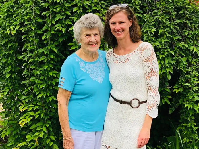 Older woman holding Derma Essential